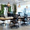 Office furniture trends: ergonomic chairs, lush plants, and open layouts for productive workspaces.