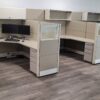 Modern pre-owned office cubicles with privacy panels and workspace desks.