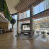 Modern lobby featuring large glass windows and stylish seating areas at Cube World USA.