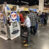 Attendees exploring Cube World USA's innovative equipment at a trade show.