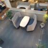 Modern office meeting space with stylish seating and plants.