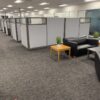 Office cubicles and lounge space with modern furniture at Cube World USA. Perfect for maximizing off.