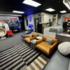 Modern office furniture display with chairs, desks, and decor at Cube World USA.