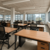 Owned office furniture setup in a bright, spacious workspace promoting productivity and cost savings.