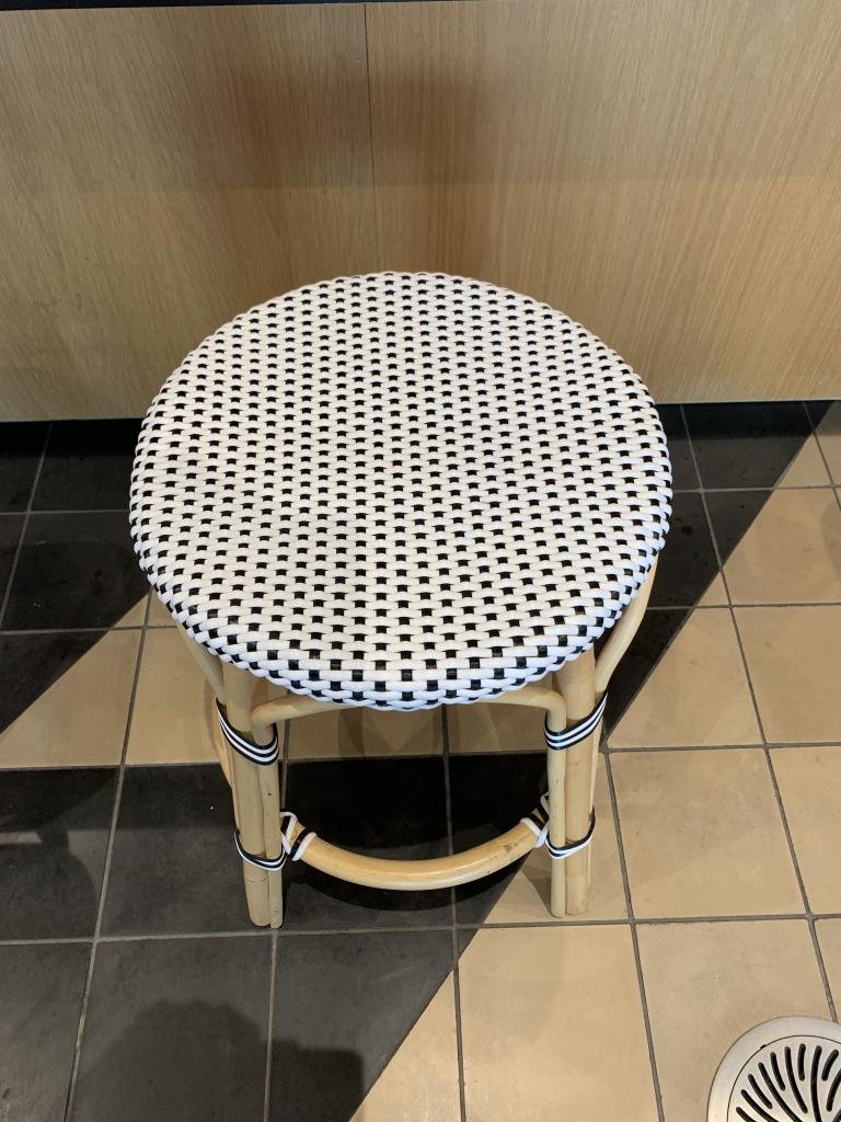 We Work white wicker style stools